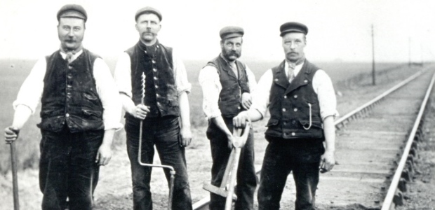 Four men laying railway track in 1893