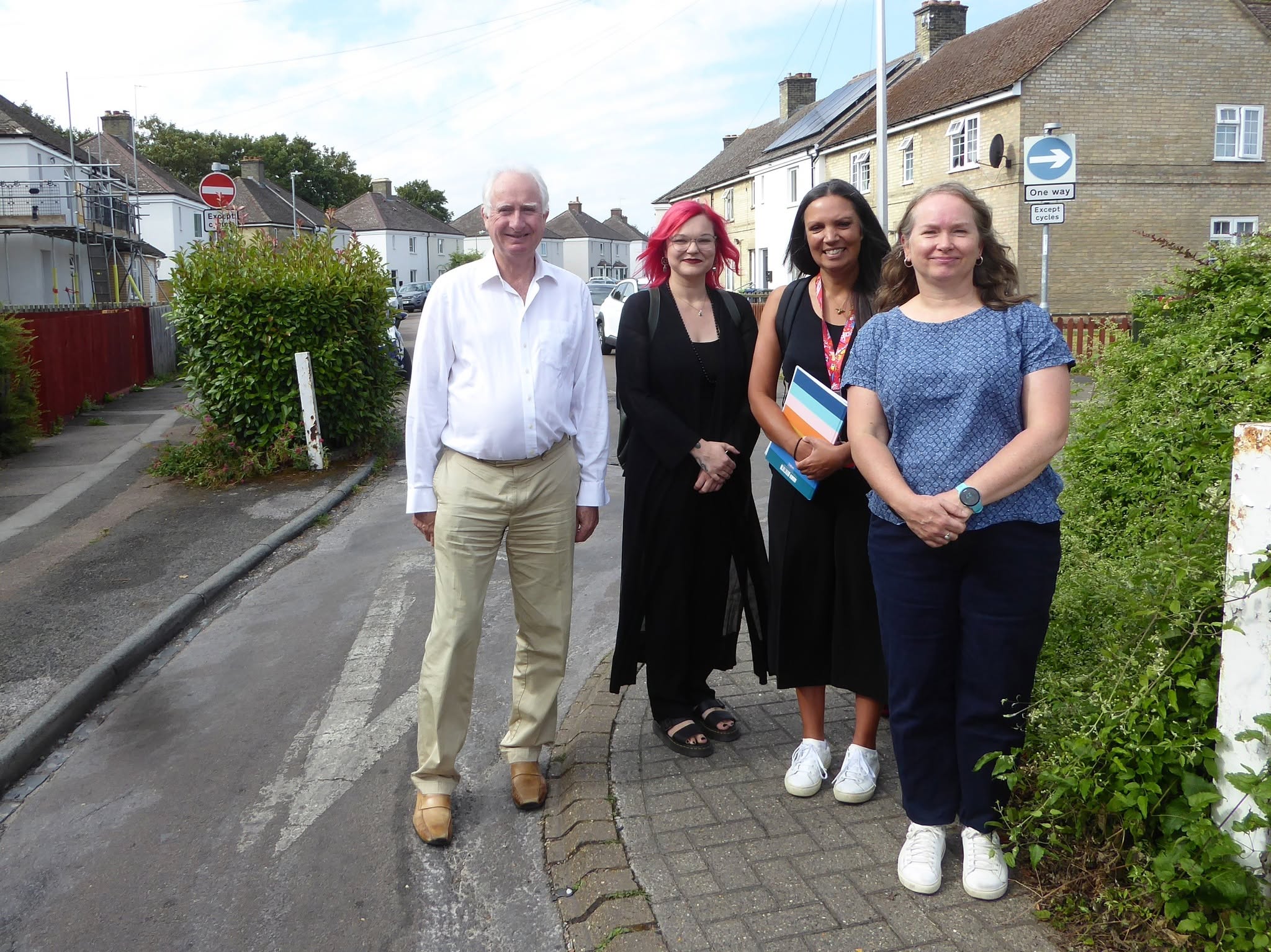 MP Daniel Zeichner with Cllr Rosy Moore and two others outside a retrofitted home