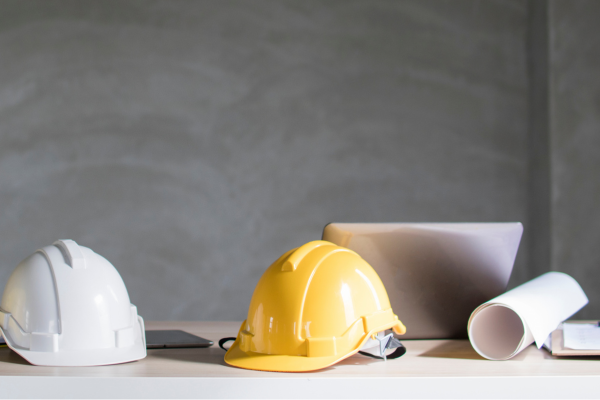 Builders hard hats laying on a table