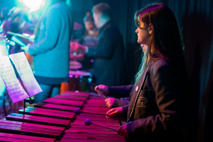 Student playing a xylophone