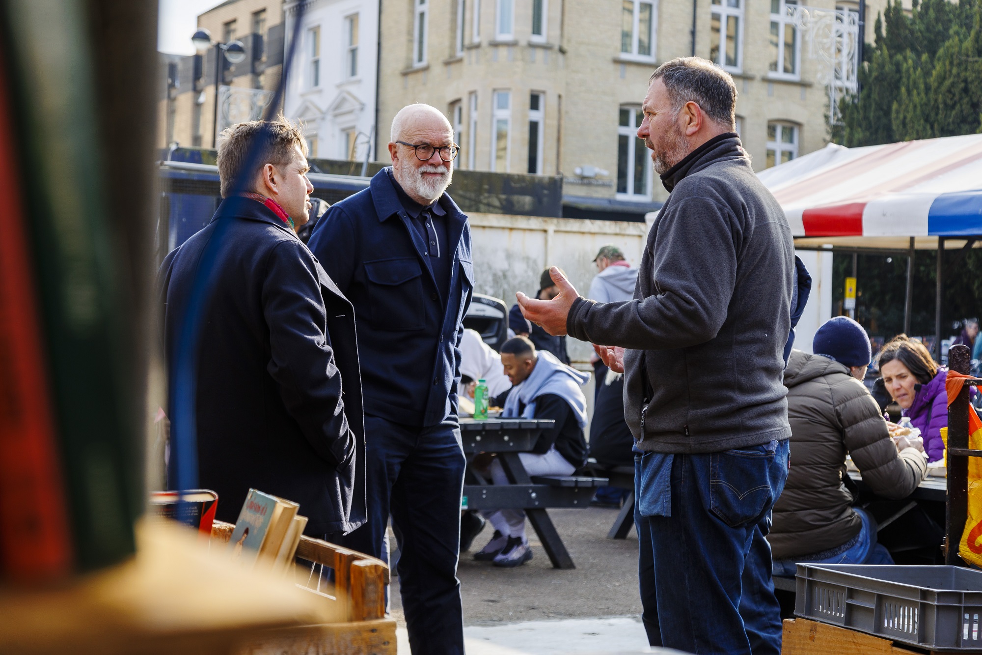 Mayor of Cambridgeshire and Peterborough left, Leader of Cambridge City Council middle, Market trader right