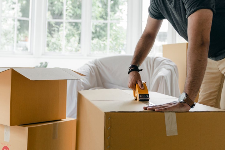 Man packing boxes ready to move home